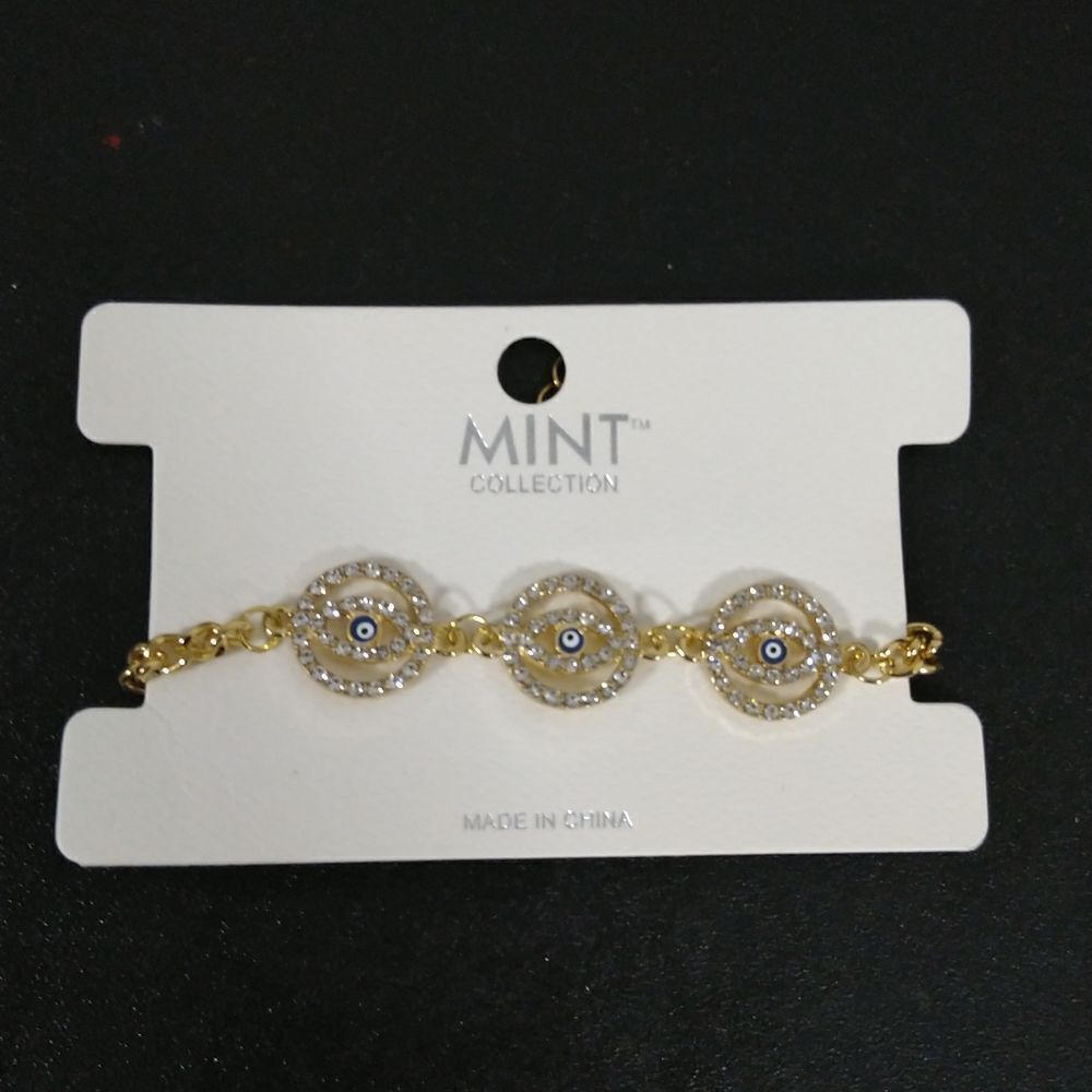 Mint Collection Gold and silver rhinestone w circular blue evil eye bracelet